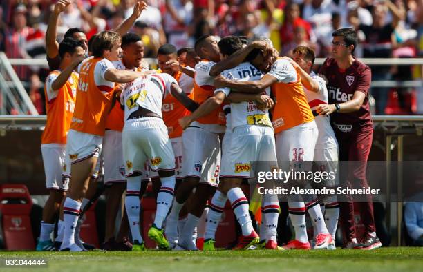 Hernanes of Sao Paulo celebrates their thirth goal with his team mates during the match between Sao Paulo and Cruzeiro for the Brasileirao Series A...