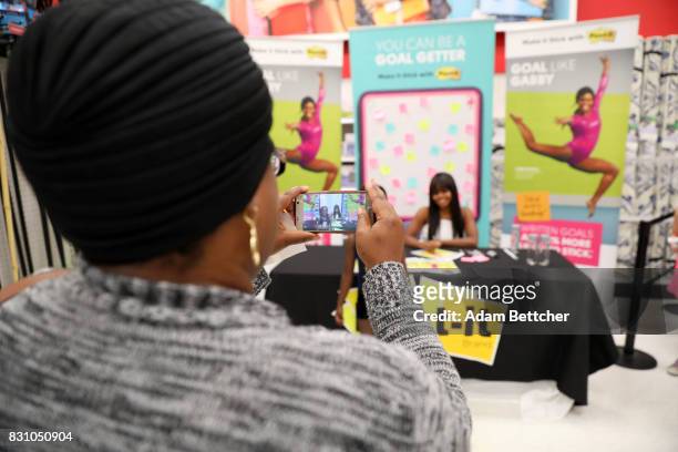 Champion Gymnast Gabby Douglas poses with Post-It Brand products on August 13, 2017 in Edina, Minnesota.