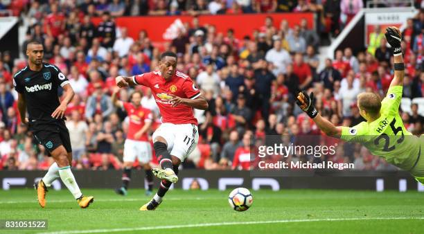Anthony Martial of Manchester United scores his sides third goal past Joe Hart of West Ham United during the Premier League match between Manchester...