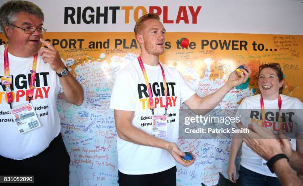 Olympic and World Champion Long Jumper Greg Rutherford juggles as he attends a Right To Play event during day ten of the 16th IAAF World Athletics...