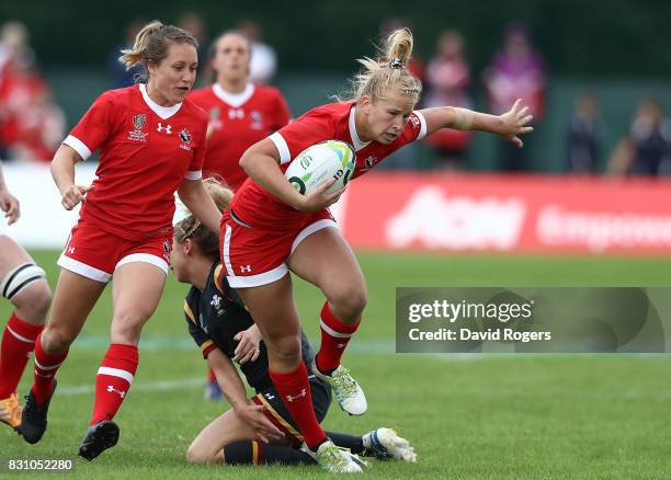 Emily Belchos of Canada is tackled by Elinor Snowsill of Wales during the Women's Rugby World Cup 2017 match between Canada and Wales on August 13,...