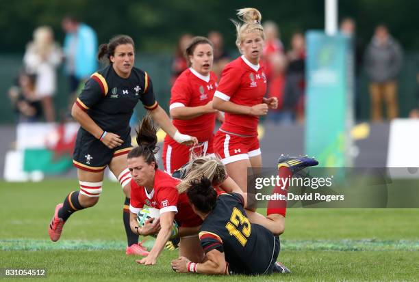 Julianne Zussman of Canada is tackled by Gemma Rowland of Wales during the Women's Rugby World Cup 2017 match between Canada and Wales on August 13,...
