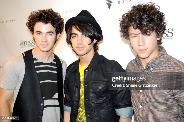 Singers Kevin Jonas, Joe Jonas and Nicholas Jonas of The Jonas Brothers arrive for the Jonas Brothers performance at The Ross School on August 9,...