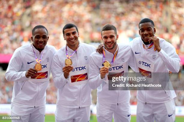 Chijindu Ujah, Adam Gemili, Daniel Talbot and Nethaneel Mitchell-Blake of Great Britain, gold, pose with their medals for the Men's 4x100 Metres...