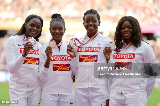 Asha Philip, Desiree Henry, Dina Asher-Smith and Daryll Neita of Great Britain, silver, pose with their medals for the Women's 4x100 Metres Relay...