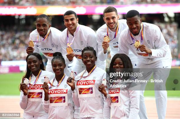 Chijindu Ujah, Adam Gemili, Daniel Talbot and Nethaneel Mitchell-Blake of Great Britain, gold, in the Men's 4x100 Metres Relay pose with Asha Philip,...