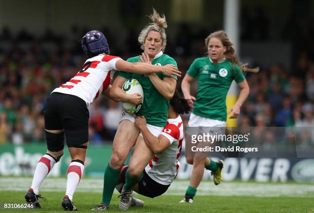 Alison Miller of Ireland is tackled by Minori Yamamoto of Japan during the Women's Rugby World Cup 2017 match between Ireland and Japan on August 13,...