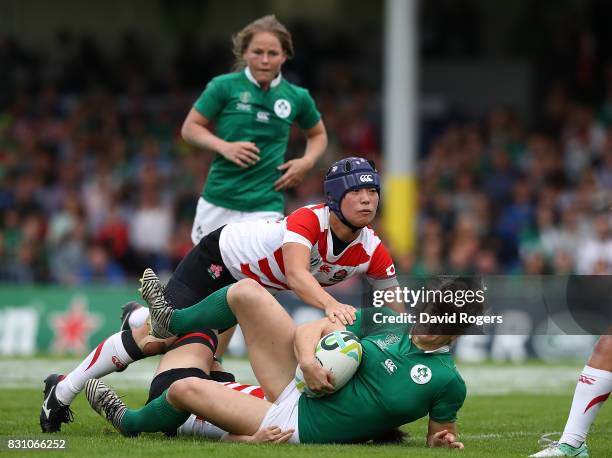 Alison Miller of Ireland is tackled by Minori Yamamoto of Japan during the Women's Rugby World Cup 2017 match between Ireland and Japan on August 13,...