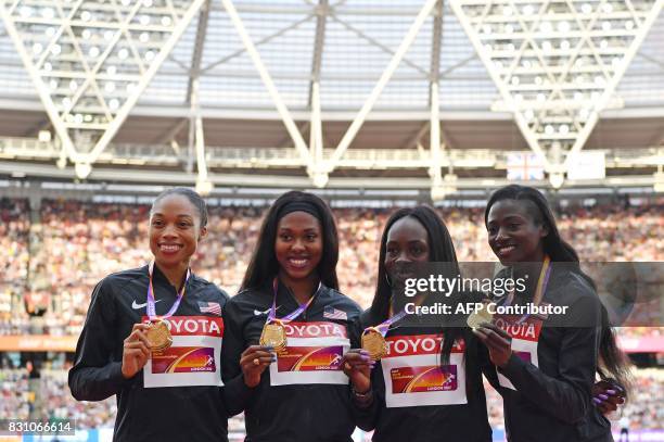 Gold medallists US athletes Aaliyah Brown, Morolake Akinosun, Allyson Felix and Tori Bowie pose on the podium during the victory ceremony for the...