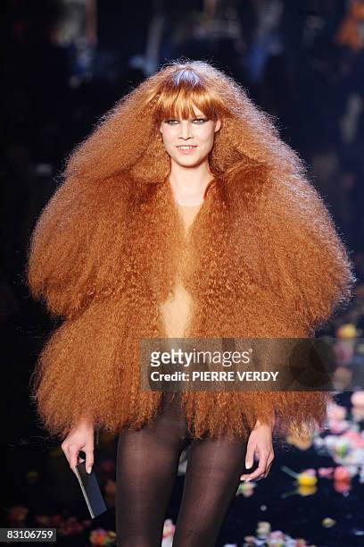 Model presents a silhouette by Belgian designer Martin Margiela in homage to French designer Sonia Rykiel after her spring/summer 2009 ready-to-wear...