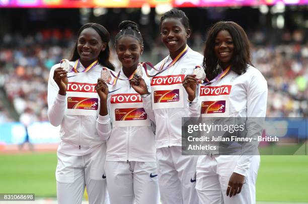 Asha Philip, Desiree Henry, Dina Asher-Smith and Daryll Neita of Great Britain, silver, pose with their medals for the Women's 4x100 Metres Relay...