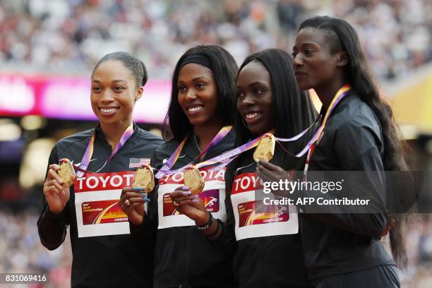 Gold medallists US athletes Aaliyah Brown, Morolake Akinosun, Allyson Felix and Tori Bowie pose on the podium during the victory ceremony for the...