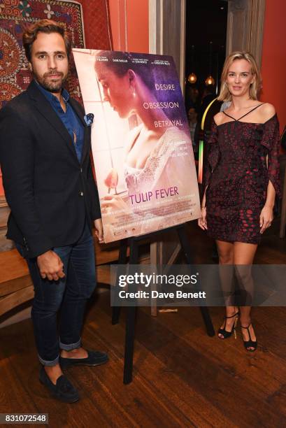 Diego Bivero-Volpe and Charlotte Carroll attend a VIP preview screening of "Tulip Fever" at The Soho Hotel on August 13, 2017 in London, England.