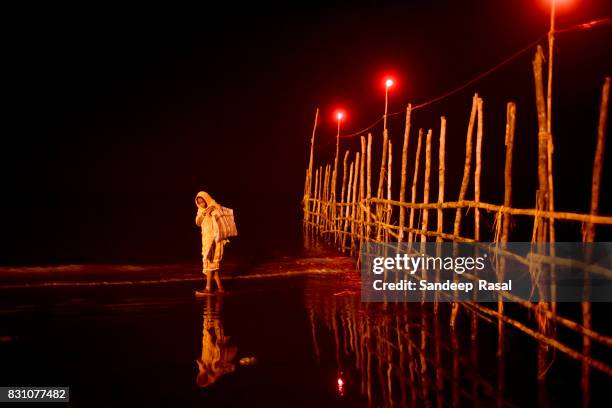 a women during ganga sagar fair - ganga sagar stock pictures, royalty-free photos & images