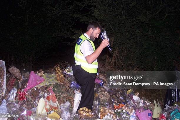 The A29 road side, in Pulborough West Sussex, where tributes for the eight year old murdered school girl, Sarah Payne are placed. Police officer's...