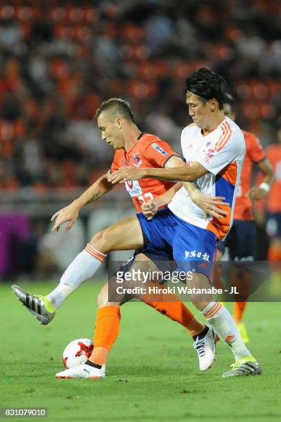 Marcelo of Omiya Ardija and Kisho Yano of Albirex Niigata compete for the ball during the J.League J1 match between Omiya Ardija and Albirex Niigata...