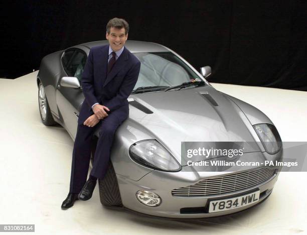 James Bond actor Pierce Brosnan with the Aston Martin Vanquish during a photocall for 'Bond 20', the working title for the latest film which starts...