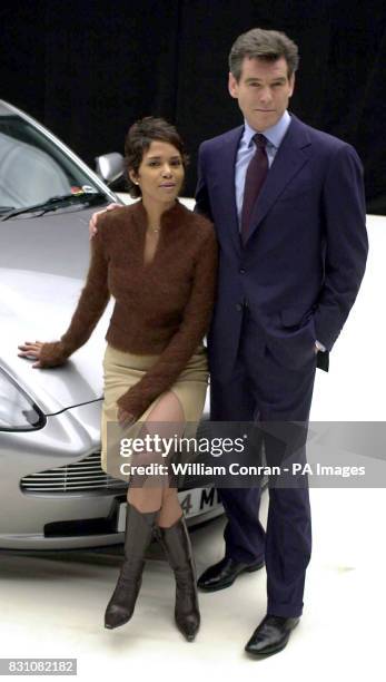 James Bond actor Pierce Brosnan and new Bond-girl Halle Berry with the Aston Martin Vanquish during a photocall at Pinewood Studios, north of London,...