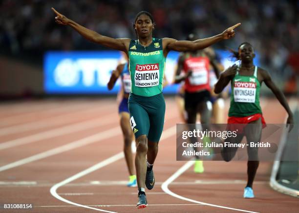 Caster Semenya of South Africa celebrates as she crosses the line ahead of Francine Niyonsaba of Burundi to win the Womens 800 metres final during...