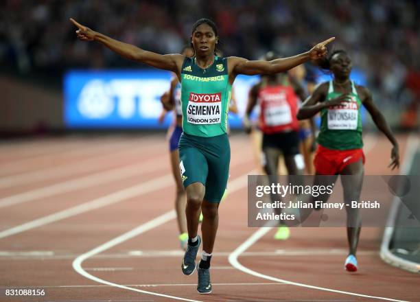 Caster Semenya of South Africa celebrates as she crosses the line ahead of Francine Niyonsaba of Burundi to win the Womens 800 metres final during...