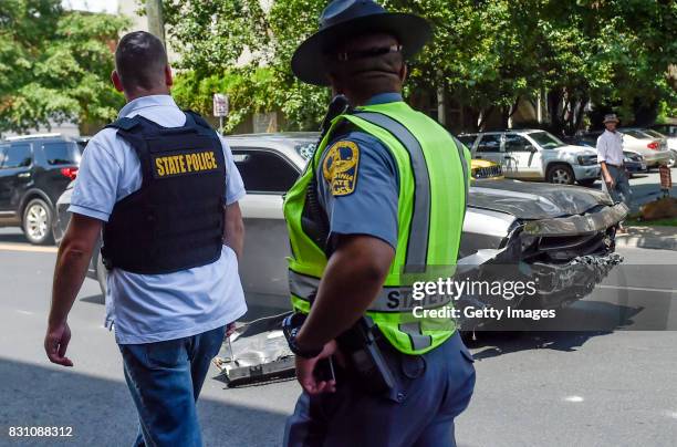 The silver Dodge Charger alledgedly driven by James Alex Fields Jr. Passes by police officers near the Market Street Parking Garage moments after...