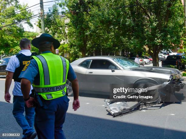 The silver Dodge Charger alledgedly driven by James Alex Fields Jr. Passes by police officers near the Market Street Parking Garage moments after...