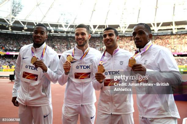 Chijindu Ujah, Adam Gemili, Daniel Talbot and Nethaneel Mitchell-Blake of Great Britain, gold, pose with their medals for the Men's 4x100 Metres...