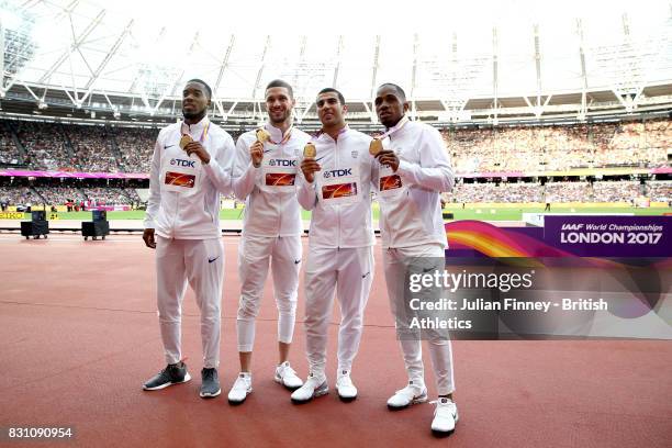 Chijindu Ujah, Adam Gemili, Daniel Talbot and Nethaneel Mitchell-Blake of Great Britain, gold, pose with their medals for the Men's 4x100 Metres...