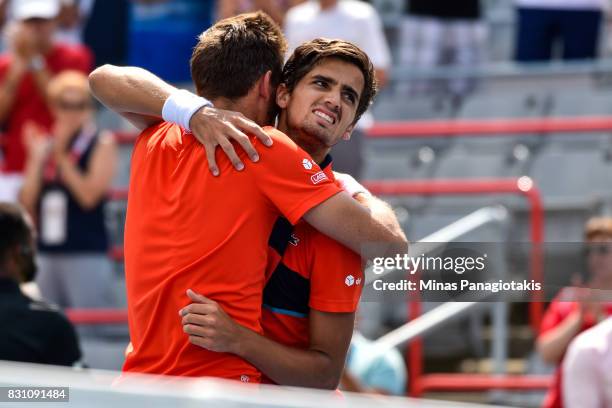 Pierre-Hugues Herbert and Nicolas Mahut of France celebrate after defeating Rohan Bopanna of India and Ivan Dodig of Croatia 6-4, 3-6, 10-6 during...