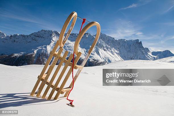 switzerland, graubuenden, savognin, winter scenery with sledge - sledge stock-fotos und bilder