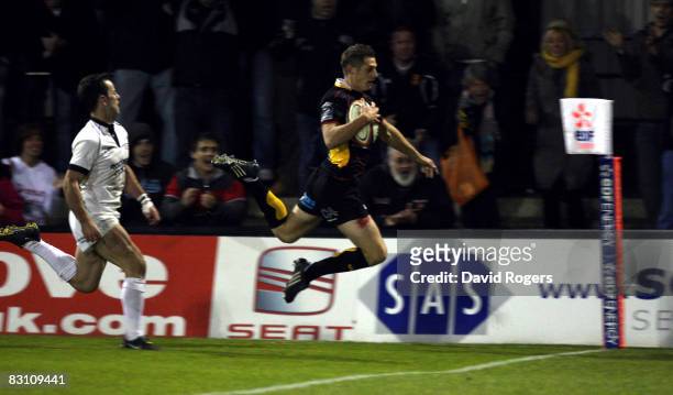 Jason Tovey of Dragons dives to score a try during the EDF Energy Cup match between Newport Gwent Dragons and Newcastle Falcons at Rodney Parade on...
