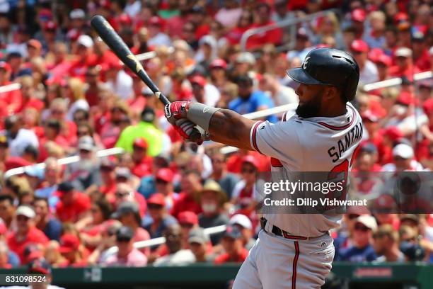 Danny Santana of the Atlanta Braves hits an RBI single against the St. Louis Cardinals in the fourth inning at Busch Stadium on August 13, 2017 in...