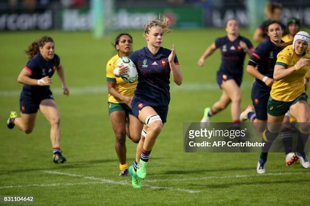 France's flanker Romane Menager runs in another try during the Women's Rugby World Cup 2017 pool C rugby match between France and Australia at The...