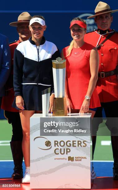 Caroline Wozniacki of Denmark with the runner up trophy and Elina Svitolina of Ukraine with the winners trophy following the final match on Day 9 of...