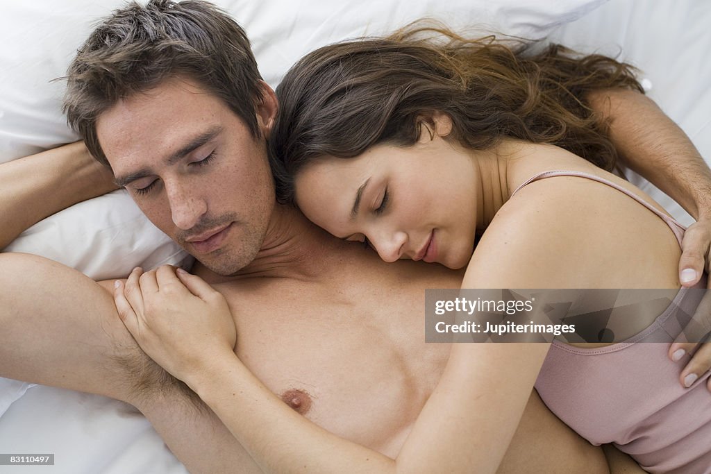 Couple sleeping in bed