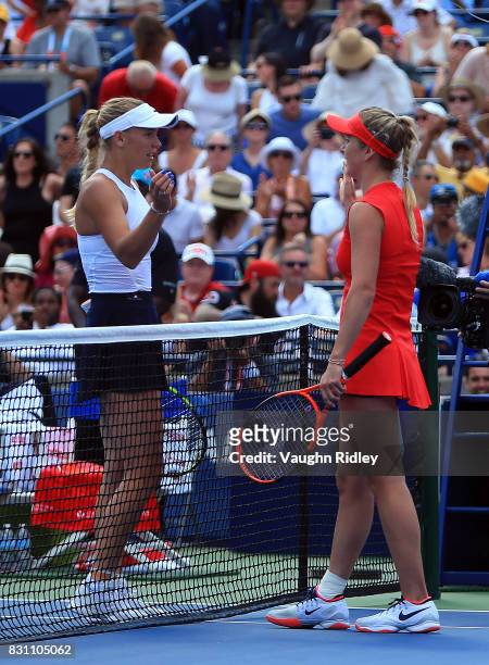 Elina Svitolina of Ukraine is congratulated by Caroline Wozniacki of Denmark following the final match on Day 9 of the Rogers Cup at Aviva Centre on...