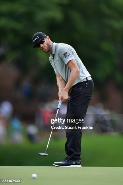 Graham DeLaet of Canada putts on the second green during the final round of the 2017 PGA Championship at Quail Hollow Club on August 13, 2017 in...