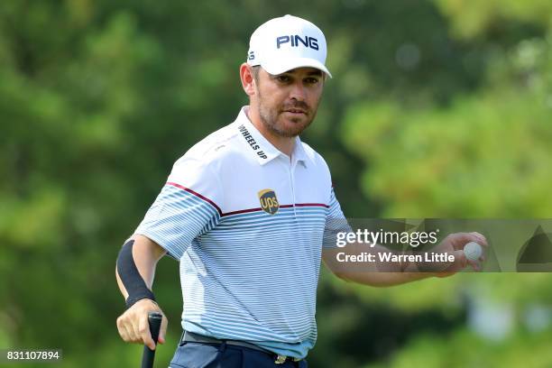 Louis Oosthuizen of South Africa reacts to his putt on the eighth green during the final round of the 2017 PGA Championship at Quail Hollow Club on...