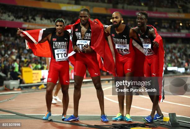 Jarrin Solomon, Jereem Richards, Machel Cedenio and Lalonde Gordon of Trinidad and Tobago celebrate after winning gold in the Men's 4x400 Metres...