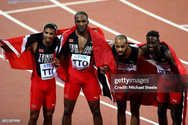 Jarrin Solomon, Jereem Richards, Machel Cedenio and Lalonde Gordon of Trinidad and Tobago celebrate after winning gold in the Men's 4x400 Metres...