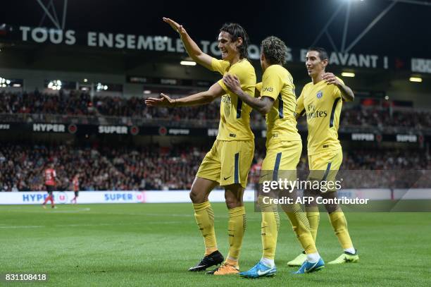 Paris Saint-Germain's Uruguayan forward Edinson Cavani celebrates after scoring a goal with Paris Saint-Germain's Brazilian forward Neymar and Paris...