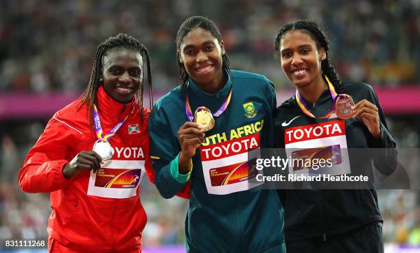 Francine Niyonsaba of Burundi, silver, Caster Semenya of South Africa, gold, and Ajee Wilson of the United States, bronze, pose with their medals for...