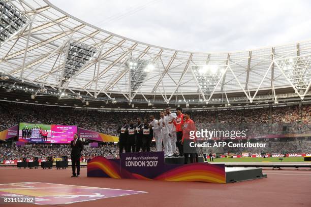 Silver medallists US athlete Justin Gatlin, Mike Rodgers, Christian Coleman and Jaylen Bacon, gold medallists Britain's Chijindu Ujah, Adam Gemili,...
