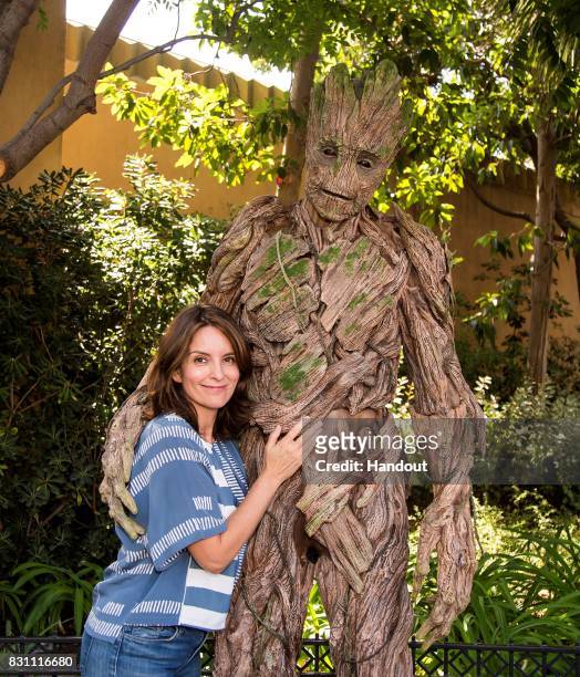 Tina Fey meets Groot of "The Guardians of The Galaxy" outside of The Guardians of The Galaxy - Mission: Breakout attraction at Disney California...