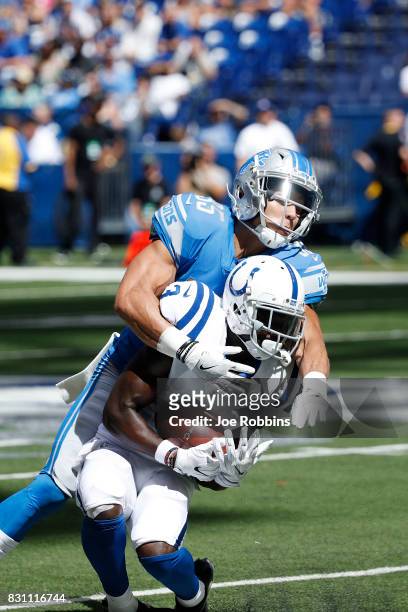 Freddie Brown of the Indianapolis Colts makes a reception against Miles Killebrew of the Detroit Lions in the second half of a preseason game at...