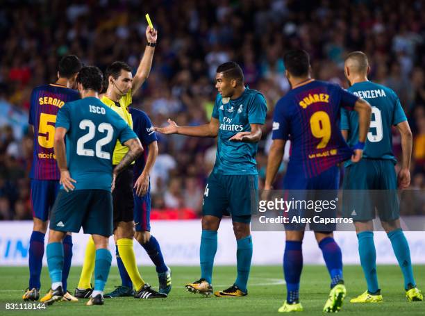 Carlos Casemiro of Real Madrid CF is shown a yellow card by referee Ricardo de Burgos Bengoetxea during the Supercopa de Espana Supercopa Final 1st...