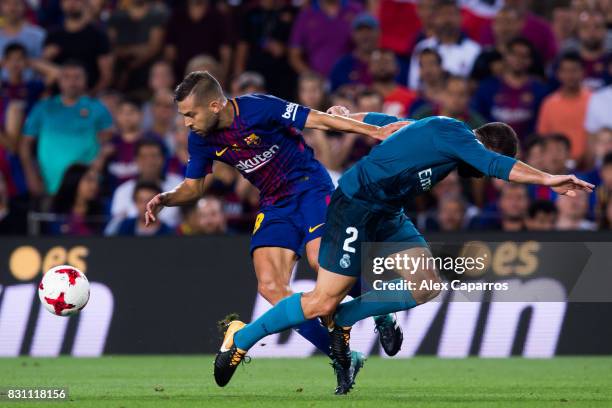 Jordi Alba of FC Barcelona fights for the ball with Daniel Carvajal of Real Madrid CF during the Supercopa de Espana Supercopa Final 1st Leg match...