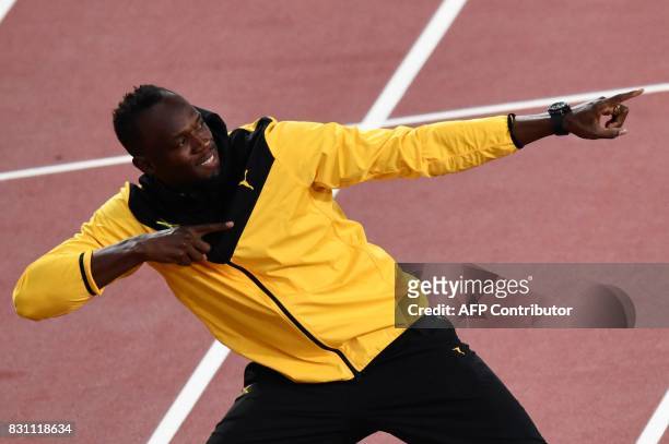Jamaica's Usain Bolt poses as he takes part in a lap of honour on the final day of the 2017 IAAF World Championships at the London Stadium in London...