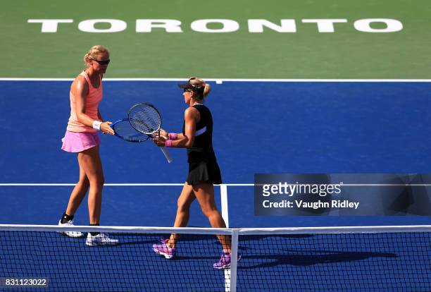 Anna-Lena Groenefeld of Germany and Kveta Peschke of Czech Republic compete against Ekaterina Makarova and Elena Vesnina of Russia in the doubles...
