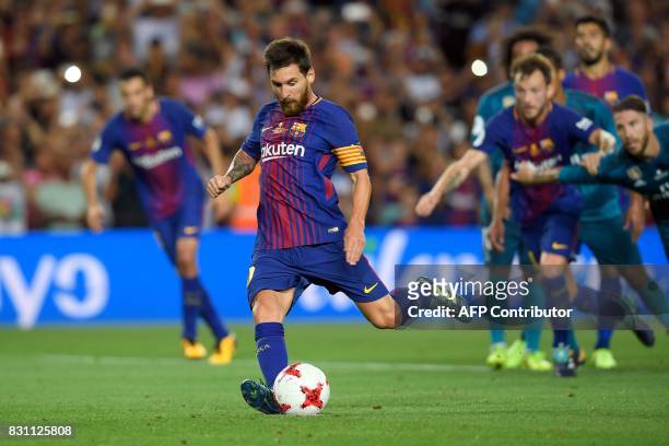 Barcelona's Argentinian forward Lionel Messi kicks a penalty shoot to score a goal during the Spanish Supercup first leg football match FC Barcelona...